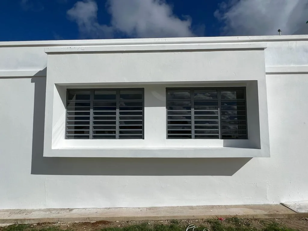 White façade with aluminum louvers